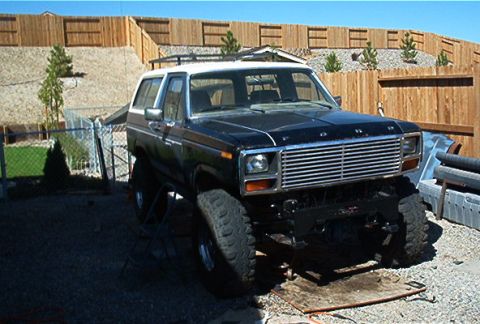 1986 Ford Bronco - This 1986 Ford Bronco features a custom front bumper and oversized tires, suggesting modifications for off-road use.