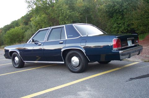 1991 Ford LTD Crown Victoria - This sedan has a distinct boxy body style, typical of cars from the late 1980s and early 1990s.