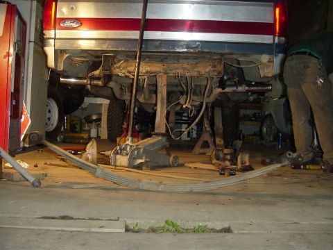 1987 Ford Bronco - The rear suspension of a 1987 Ford Bronco is shown with leaf springs removed for maintenance.