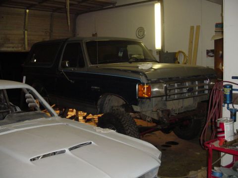 1987 Ford Bronco - pulled in forward to work on the back. notice the 10sec stang next to the Bko!