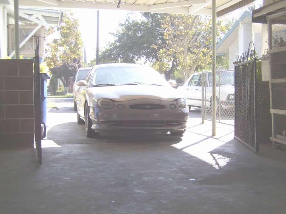 1998 Mercury Sable parked under a carport, front view