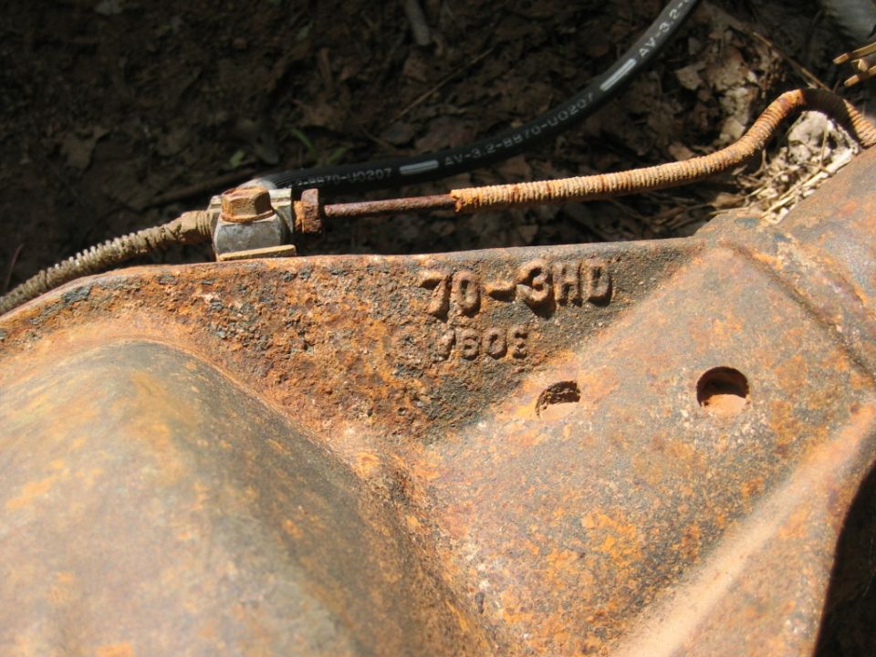 Rusty differential housing with stamped numbers '70-3HD' and '7503'
