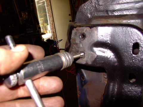 1986 Ford Bronco - Cleaned all the metric threads out on the carrier bracket supports after removing all the broken bolts.