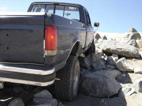 1988 Ford Bronco - This pickup truck, likely from the late 1980s, is shown navigating a rocky terrain.