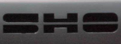 1998 Ford Taurus - A close-up view of a black 'SHO' badge.
