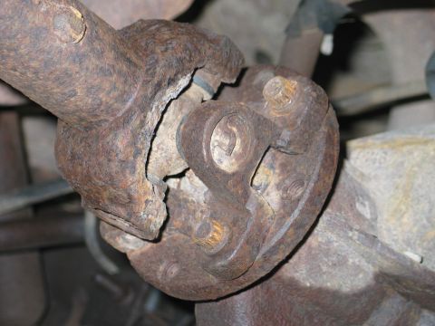 1995 Ford Bronco - Remove the 4 bolts from the rear axle using a 12mm or 1/2" 12 point socket or wrench.