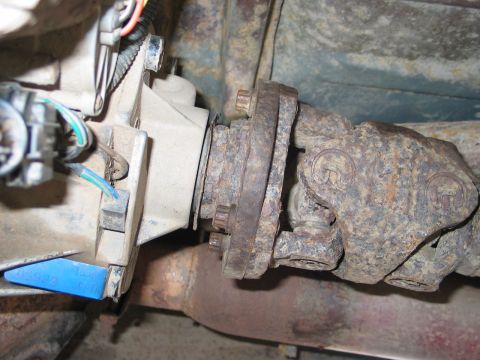1995 Ford Bronco - Remove 4 bolts from transfer case using a 12mm or 1/2" wrench. You will not be able to remove the bolts using a socket. There's isn't enoug…