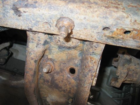 1995 Ford Bronco - Remove the x-member bolts. Using an impact gun or breaker bar will make this much easier. 3 bolts on the drivers side used a 11/16" deep we…