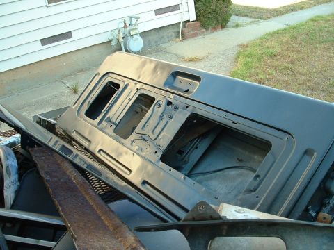 1990 Ford Bronco - A detached tailgate is visible, resting on a trailer next to a house.