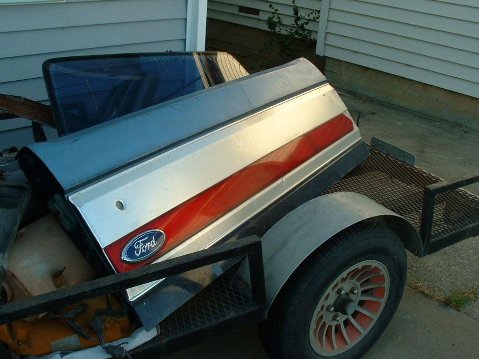 Ford tailgate with red stripe and Ford logo on trailer