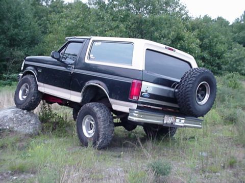 1993 Ford Bronco - This lifted Ford Bronco is shown off-road with its rear spare tire mounted.
