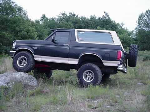1993 Ford Bronco - This 1993 Ford Bronco is shown navigating an off-road obstacle.