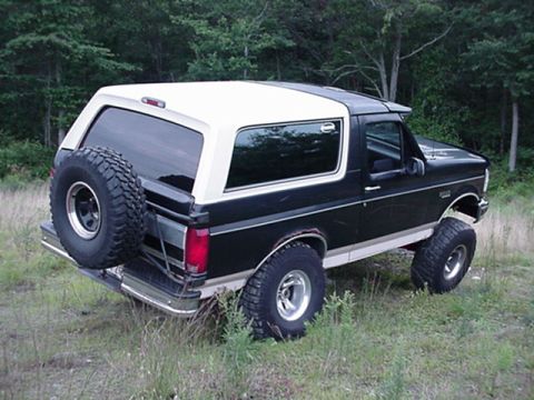 1993 Ford Bronco - This 1993 Ford Bronco is shown from a three-quarter front angle, parked outdoors.