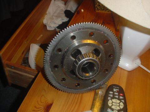 1988 Ford Bronco - A close-up view of a differential gear set, likely a replacement part, is shown on a table.
