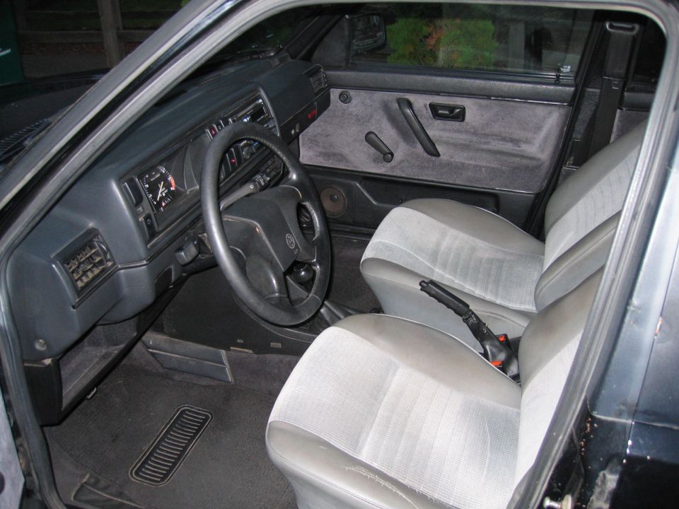 Gray VW Golf interior with cloth seats and steering wheel