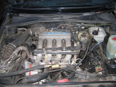 1987 Volkswagen Golf - Engine bay detail showing the DOHC 16V engine and surrounding components.