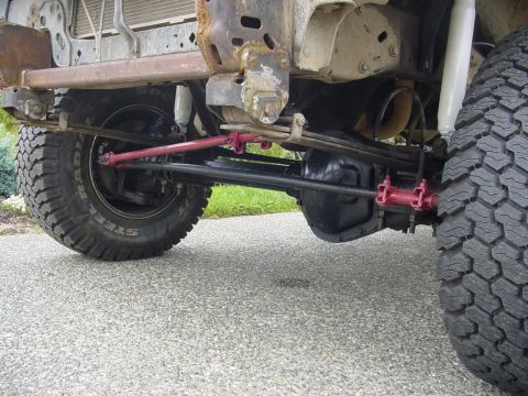 1987 Ford Bronco - Front axle and steering components are visible in this close-up shot.