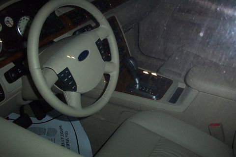 1993 Ford Taurus - Interior of a 2005 Ford Five Hundred, the steering wheel, dashboard, and automatic transmission shifter.