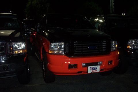 1993 Ford Taurus - This truck has a two-tone paint job with an orange bumper and grille.