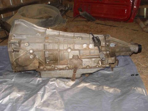 1988 Ford Bronco - Automatic transmission shown on a plastic sheet in a workshop setting.