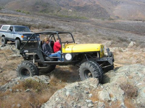 1989 Ford Bronco - Modified Jeep and Ford Bronco navigate a challenging rocky off-road course.