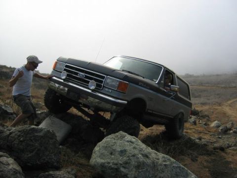 1989 Ford Bronco - 1989 Ford Bronco navigating a challenging rocky off-road course.