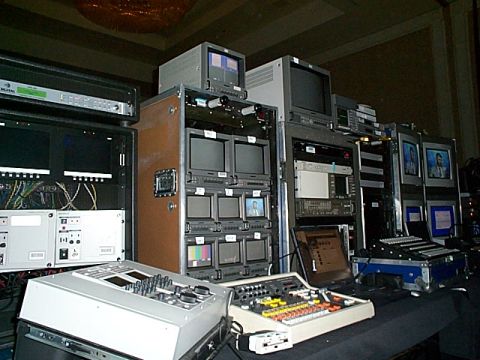 1994 Ford Bronco - A collection of video production equipment is set up, multiple monitors, audio mixers, and a laptop computer.