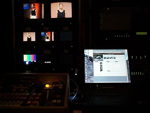 1994 Ford Bronco - A control room setup with multiple screens displaying video feeds and a laptop showing a webpage.