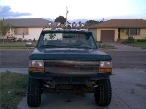 1995 Ford Bronco - This 1995 Ford Bronco is parked in front of a suburban house.