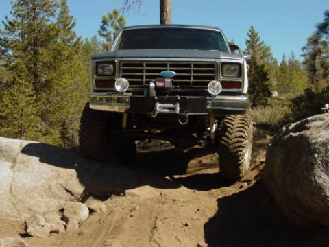 1986 Ford Bronco - This lifted 1986 Ford Bronco tackles a challenging rocky trail, its off-road capabilities.