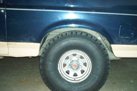 1989 Ford Bronco - left rear with front right up on a ramp...