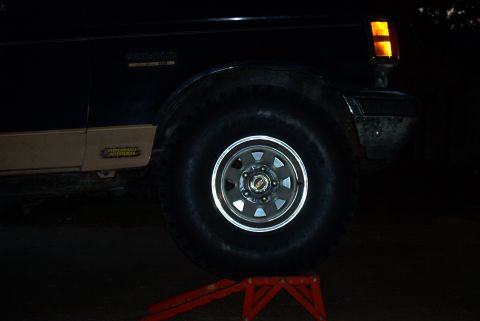 1989 Ford Bronco - front right tire on ramp, still inches away from body (dark again)