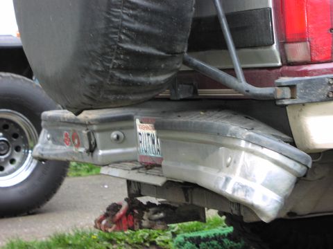 1993 Ford Bronco - Rear view of a 1993 Ford Bronco, showing the bumper, spare tire, and a Washington state license plate.
