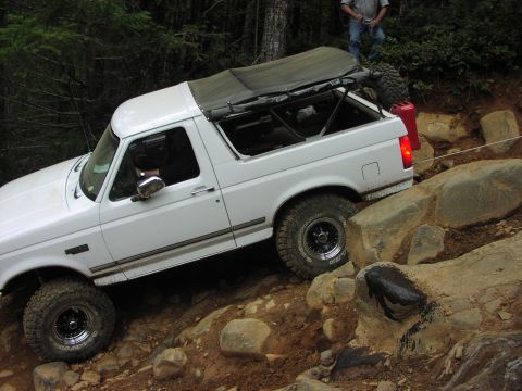 1993 Ford Bronco - This SUV is shown off-roading on a challenging, rocky trail.