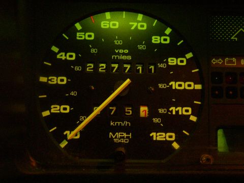 1987 Volkswagen Golf - The illuminated dashboard gauge cluster displays mileage and speed readings.