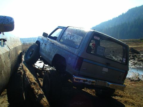 1984 Ford Bronco II - Ford Bronco II navigating an off-road obstacle course with a second vehicle nearby.