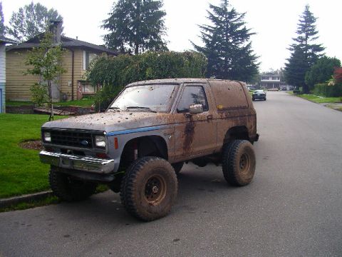 1984 Ford Bronco II - This lifted 1984 Ford Bronco II is covered in mud after an off-road excursion.