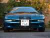 1994 Ford Probe - Front view of a blue car with a license plate.