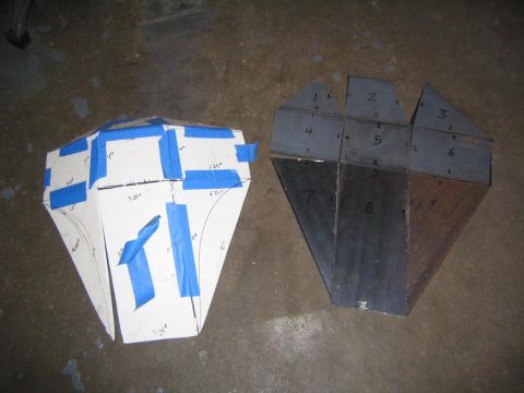 1978 Ford Bronco - Templates and cut metal pieces are laid out on a concrete floor, possibly for fabricating a vehicle skid plate.