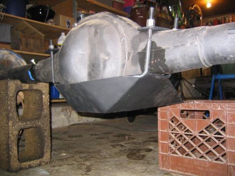 1978 Ford Bronco - A differential skid plate is shown installed on an axle, elevated for maintenance.