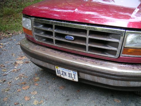 1994 Ford Bronco - Front view of a red 1994 Ford Bronco, its grille and bumper with a Virginia license plate.