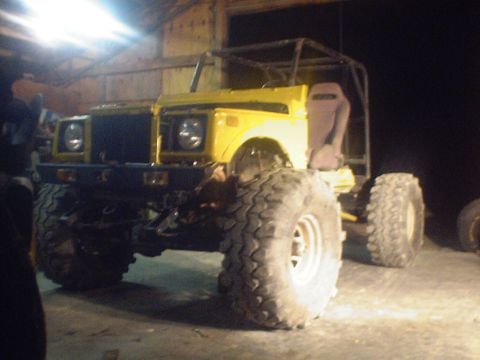 1989 Ford Bronco - This heavily modified off-road vehicle has oversized tires and a custom roll cage, obscuring its original model year.