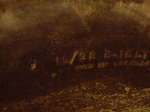 1989 Ford Bronco - A close-up of a vehicle part shows stamped text including '10/28 G-16LT' and 'GOLD EXT 19V160'.