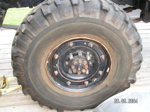 1978 Ford Bronco - A close-up view of a tire and wheel assembly, likely from an off-road vehicle.