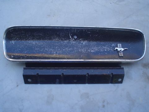 1993 Ford Taurus - A Ford Mustang emblem is shown with a metal bracket, likely for a vehicle part.