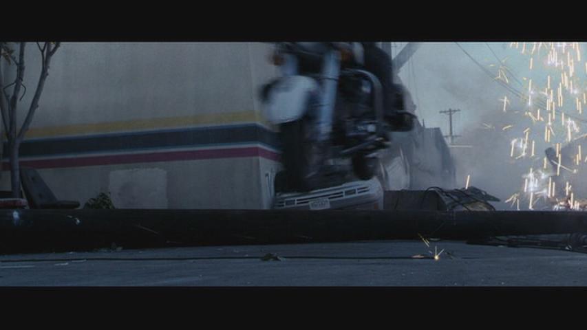 Overturned vehicle with sparks flying, low angle view