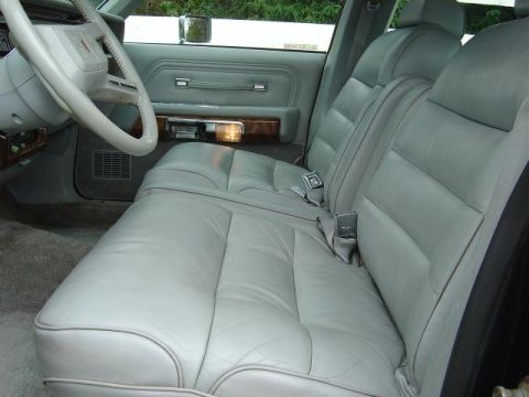 1985 Mercury Grand Marquis - Interior view of a 1985 Mercury Grand Marquis, highlighting the light gray leather seats and dashboard details.