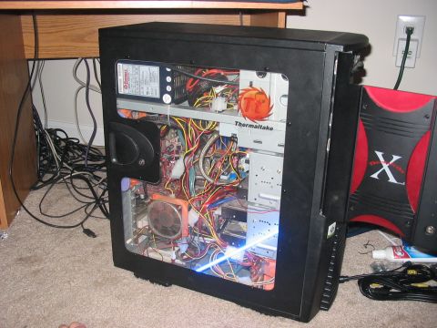 1988 Ford Bronco - Custom-built computer tower with side panel removed, revealing internal components and extensive wiring.