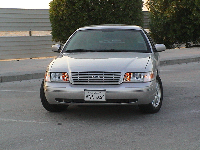 Front view of a silver 2004 Ford Crown Victoria with a Saudi Arabian license plate