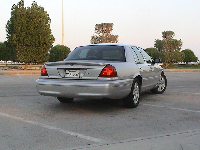 Silver 2004 Ford Crown Victoria sedan, rear view